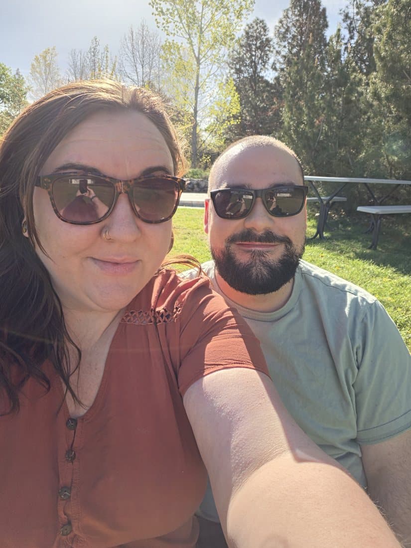 Robbie and Caitlin taking a sunny selfie together at the park